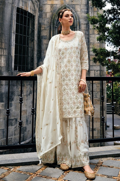 Buy Ivory Heavy Embroidered Sharara Suit at PinkPhulkari CaliforniaBuy Ivory Heavy Embroidered Sharara Suit at PinkPhulkari California